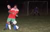Luis Vas of Tortorella protecting the ball from Roger King of Bayberry