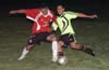 Christian Munoz of Tortorella(left) and Romulo Tubatan of the Rottweilers going for the ball