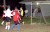 Luis Vas(#9) of Tortoralla waiting for the header by Rodolfo Marin(red left) that he will hit into the net to win the match