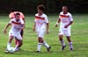 Daniel Bedoya of Bateman about to move up the field as team mates, Turpan Moss(center) and Julian Munoz look on