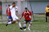 Carlos Torres of Bateman can not do much with the ball as Christian Munoz of Tortorella just watches