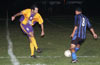 Gehdier Garcia of Maidstone(#8) get by a Cesar Morton(left) of ED-Tuxpan