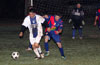 Jonathan Lizano of Bateman protecting the ball from Juan Velazquez of ED-Tuxpan