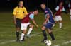 Who will get to the ball first, Rumulo Tubatan of 75 Main(left) or Cesar Betancur of Espo's