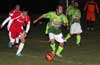 Cristian Munoz of Tortorella Pools(left) determined to get the ball before Alberto Larios of FC Tuxpan can get the shot off