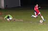 Rodolfo Marin of Tortorella Pools(right) ran around a FC Tuxpan defender to get the ball