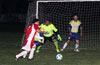 Stiven Orrego of Tortorella Pools dribbling in front of the FC Tuxpan goal to get a better shot