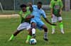 Nettie Sanchez of FC Tuxpan(left) and Winston Reid of Bateman Painting fighting for the ball