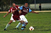 Luis Correa of Maidstone(right) protecting the ball from Rene Gutierrez of Tortorella