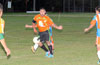 Fabian Arias of The Hideaway(rear) trying to kick the ball away from Martin Zuniga of Hampton FC