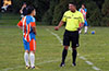 Cesar Correa of The Hideaway taking with the referee before the start of the match