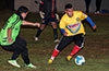 Carlos Portillo of FC Tuxpan(right) moving the ball past Alex Meza of Hampton FC
