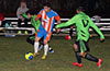 Cesar Correa of The Hideaway(center) about to dribble by Leonardo Garcia(left) and Cristian Pena of Hampton FC
