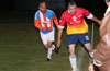 Daniel Londono of FC Tuxpan keeping the ball in play as Alfredo Negrete of The Hideaway looks on