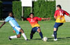 Winston Reid of Bateman Painting(left) losing the ball to Nettie Sanchez(center) and Daniel Londono of FC Tuxpan