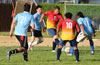 Daniel Londono of FC Tuxpan(center) surrounded by the Bateman Painting defenders