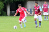 Cristian Duran of Tortorella(left) about to blast the ball up the field as Mathew Ramirez of Maidstone looks on