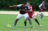 Diego Marles of Maidstone(left) holding off Stiven Orrego who is trying to push him away from the ball