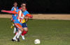 Alfredo Negrete of The Hideaway(front) and Danny Londono of FC Tuxpan(rear) going for the ball
