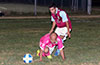Ivan Espinoza of FC Tuxpan on his knees trying to protect the ball from Mario Olaya of Maidstone