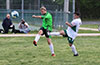 Gerard Lynch of Hampton FC(left) kicking the ball past Miguel Bautista of FC Tuxpan as he tries to block it