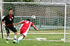 David Rodriguez of Tortorella(right) heads the ball just wide