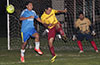 Alberto Carreto of FC Tuxpan blasting the ball past Juan Zuluaga of Bateman Painting