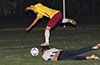 A FC Tuxpan forward jumping over Cristian Rios of Bateman Painting