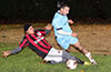 Jose Guarra of Sag Harbor(left) sliding to steal the ball from Danny Salazer of Hampton FC