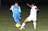 Rodolfo Marin of Tortorella Pools(left) dribbling the ball past Nettie Sanchez of FC Tuxpan