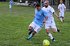 Esteban Valverde of Maidstone(left) and Alfredo Negrete of FC Tuxpan puhing each other for the ball