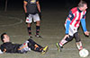 Luis Correa of Maidstone Market(ground) sliding to steal the ball from Gonzalo Presedo of Bateman Painting