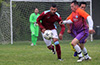 Oscar Murillo of Maidstone Market pushing the ball forward as Luis Munoz of FC Tuxpan tries to turn to catch him