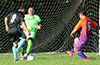 FC Tuxpan goalie, Antonio Chavez, trying to block the shot by Jonathan Lizano of Bateman Painting(#8)
