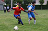 Dante Donigal of EH Soccer Fever(left) and Jean Paul Palacios of Tortorella Pools racing toward the ball