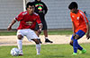 Fredy Pedro of EH Soccer Fever(right) watching Jeremias Simon of Sag Harbor