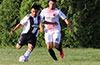 eremias Simon of Sag Harbor getting rid of the ball before Robert Cueva(right) can get it