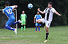 Juan Zuluaga of Sag Harbor (right) about to knee trap the ball