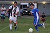 Eddie Lopez of Tortorella Pools(right) about to dribble past Donald Martinez of FC Tuxpan