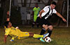 Romario Arellano of FC Tuxpan sliding to steal the ball from Gabriel Aroyo of Sag Harbor