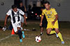 Romario Arellano of FC Tuxpan(right) trying to get by a Sag Harbor defender