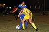 Jean Paul Palacious of FC Tuxpan(front) trying to get by Cristian Munoz of Tortorella Pools