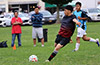 Santiago Solis of Liga de Gulag blasting the ball up the field