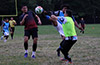Eddy Sanchez of Napoli trying to kick the ball away from Jonnathan Barros of Liga de Gulag
