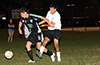 A Suchos United defender(right) holding onto Brandon Ospina of Maidstone Market