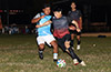 Santago Solis of Liga de Gulag(right) getting by a Napoli defender