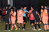 Both sides arguing about the location the foul near the goalie box