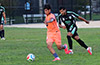 Cesar Lopez of FC Tuxpan out running John Romero of Maidstone Market