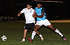 Leo Moran of Napoli(right) trying to push Gary Gutama of Suchos United off the ball