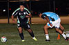 Gehider Garcia of Maidstone Market(left) will out run Nelson Moran of Napoli toward the bal